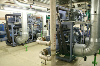 Interior view of a room with machine tools and pipes